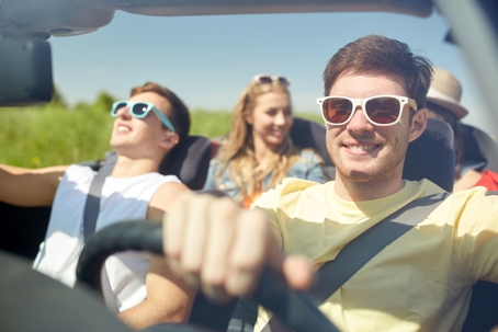 teen drivers, group of teens driving, road trip